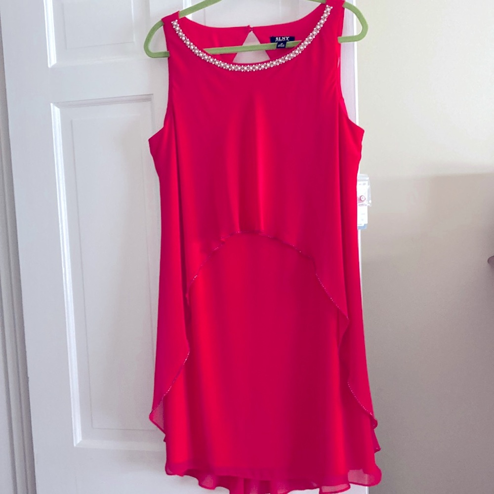 Dress lined with pearl/sparkle neckline opening in back